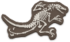 Completed Dinosaur Fossil with its head at the upper right, tail to the left, and legs below the body